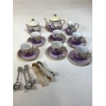 An Edwardian dolls/childs teas set transfer printed with violets A/F