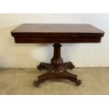 A Victorian rosewood card table with fold and twist top to green baize. W:92cm x D:46cm x H:75cm