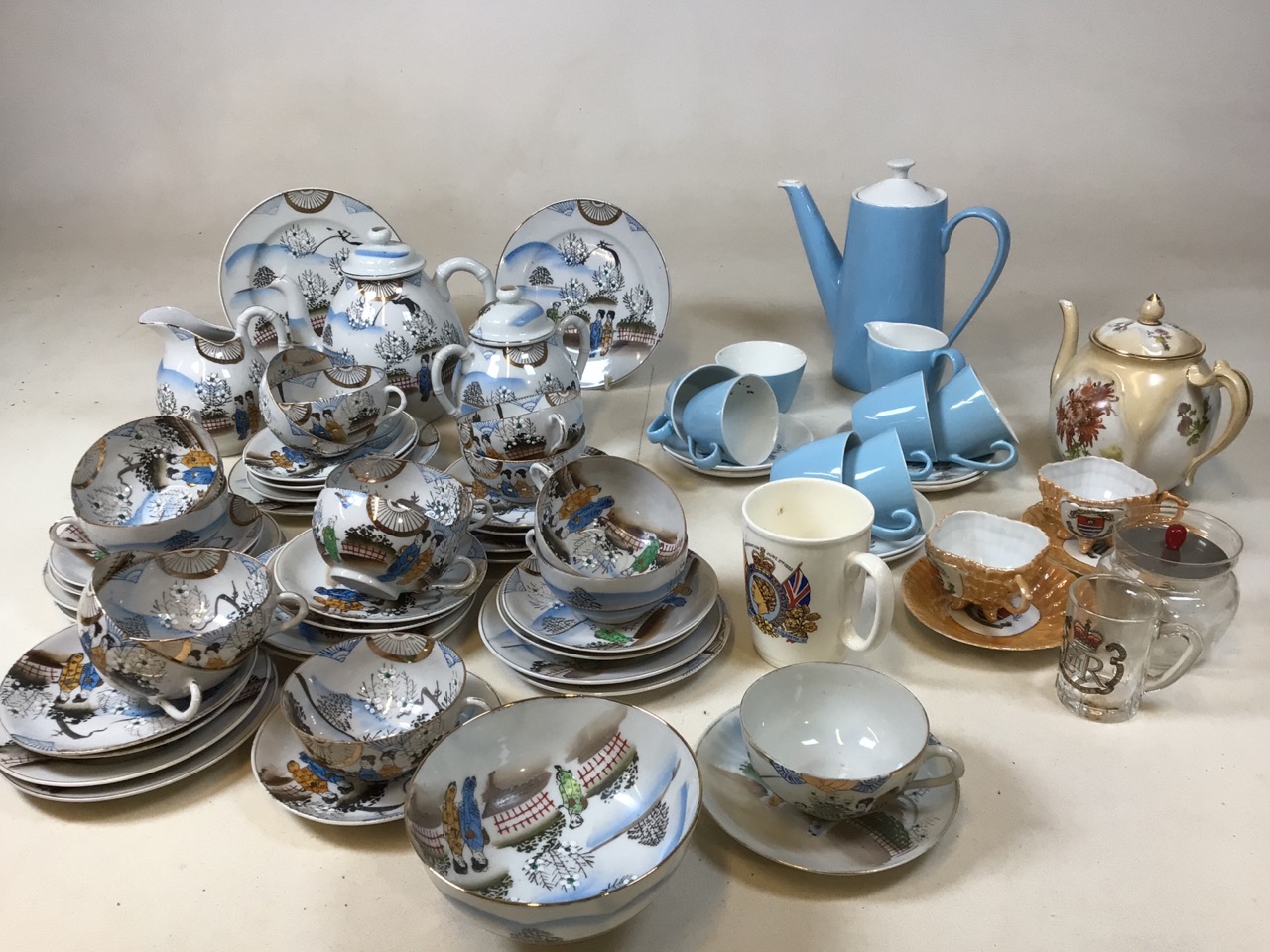 A 20 century hand painted Japanese tea set comprising teapot, jug, sugar bowls, tea plates, cups and