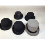 A Moss Bros grey top hat size 7 together with 3 Triple crown bowler hats by Harry Hall and