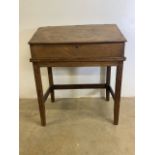 A late 19th early 20th century elm teachers school desk. W:91cm x D:58cm x H:108cm