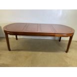 A large oriental rosewood extending dining table with two extra leaves. Extended W:245cm x D:107cm x