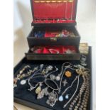 A large quantity of costume jewellery to include Scottish and silver brooches etc.