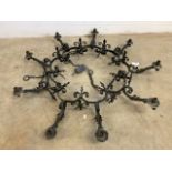 A wrought iron gothic style chandelier. W:110cm x D:110cm x