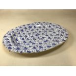 A large blue and white Victorian transfer printed meat platter W:54cm x H:43cm