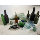A collection of coloured glass bottles and stoppers.
