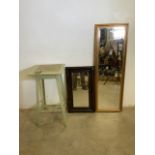 Two mirrors and a painted plant stand.