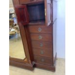 A large Edwardian inlaid mahogany compactum wardrobe. Large central mirrored door to hanging space