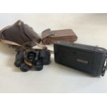 A pair of Ross binoculars also with an early Kodak camera.
