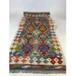 A Chobi Kilim runner. W:196cm x H:65cm