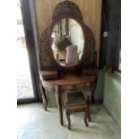 A French painted heavily carved demi lune dressing table also with a stool recovered from a chateaux
