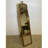 An early 20th century French walnut Tailors mirror with brass eagle finial. A frame stand and