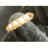 An 18ct pearl ring (stone missing)