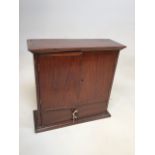 An oak cupboard with drawer to base - an apprentice piece. With original key
