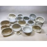 17 jelly moulds of varying designs some A/F