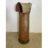 A Large terracotta hooded chimney pot. H:110cm