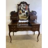 A Queen Anne style large dressing table with moulded details central bevelled swing mirror and seven