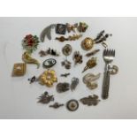 A large selection of brooches to include two silver hall marked brooches, silver filigree