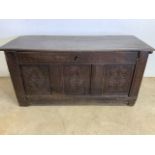 An antique carved oak coffer. (A.F mdf base and drop down front) W:136cm x D:52cm x H:65cm