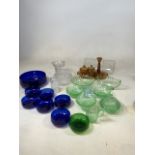 A quantity of vintage coloured glass including an amber dressing table set, green glass serving