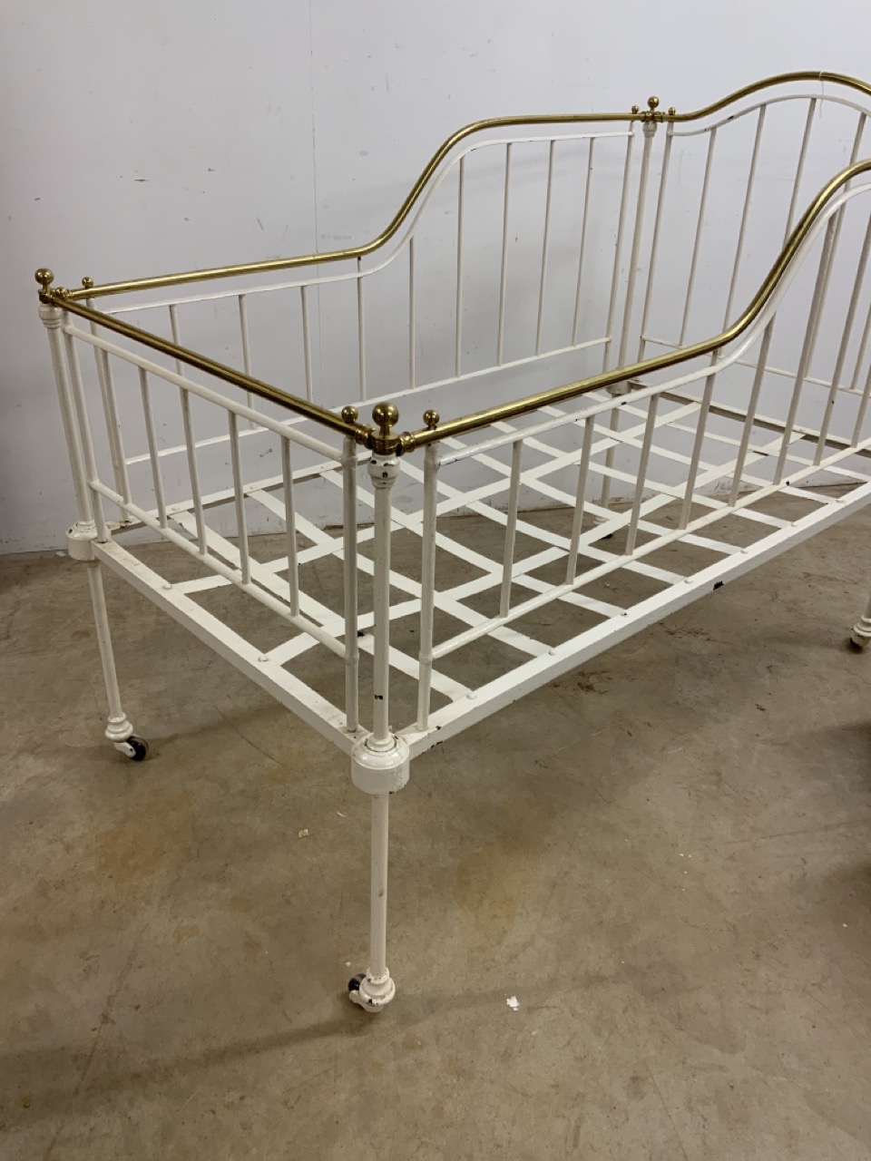 A Victorian brass and iron cot bed. W:140cm x D:75cm x H:111cm - Image 2 of 2