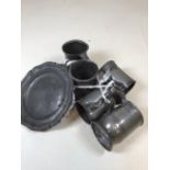 A quantity of pewter items - mainly tankards