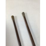 Two bamboo swagger sticks. Royal engineers George V engraved top, white metal obscured marks, the