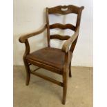 A french walnut ladder back arm chair with leather seat. H:43cm