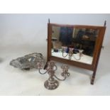 A swing mirror also with a silver plated table candelabra and a large platted handled dish.