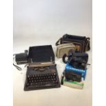 A portable vintage typewriter, a Dansette radio and a quantity of cameras