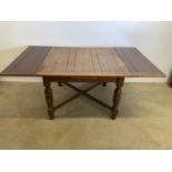 A Drawer leaf oak table. W:183cm x D:106cm x H:74cm W:107cm x D:106cm x H:74cm