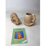 A Sylvac Otter together a large acorn squirrel vase and a Sylvac book