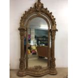 A very large modern baroque style mirror with a gilded moulded frame. W:136cm x H:252cm