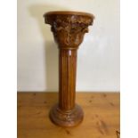 A large marble topped column with carved and turned details, circular top with inset marble. W: