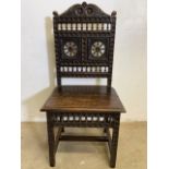 A heavily carved hall chair, late 19th early 20th century. Seat height H:45cm