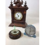 An Ansonia Company clock in A/F condition W:27cm x H:38cm also with a barometer and a Smith Alarm