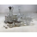 A glass tray with silver plated surround, a claret jug and decanter, glasses, a condiment set and
