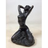 A bronze style figurine of a kneeling nude - copyright stamp to base 1986 W:22cm x H:35cm