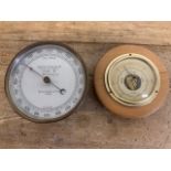 A Wilson, Warden and co ltd London brass barometer also with another barometer.