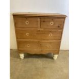 A small antique pine chest of drawers with two short of two long drawers. (A.F missing handles.) W: