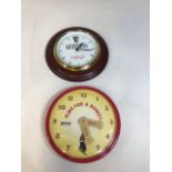 A Guinness wall clock and a Bonio clock. Both quartz - untested W:26cm Guinness dimensions