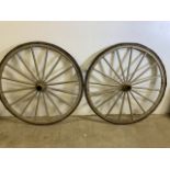 A pair of large cart wheels. H:108cm