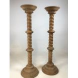 A pair of turned plant stands H:97cm