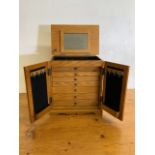 A Thomas Pacconi watch makers or jewellery cabinet with seven internal drawers, lift up lid to