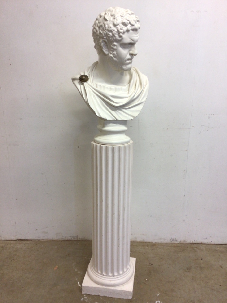 A plaster bust of Ciceroni on a pillar. H:150cm