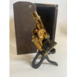 A Henry Crouch London 8922 brass microscope and box. Marked S.M.A.W son and Thompson agents