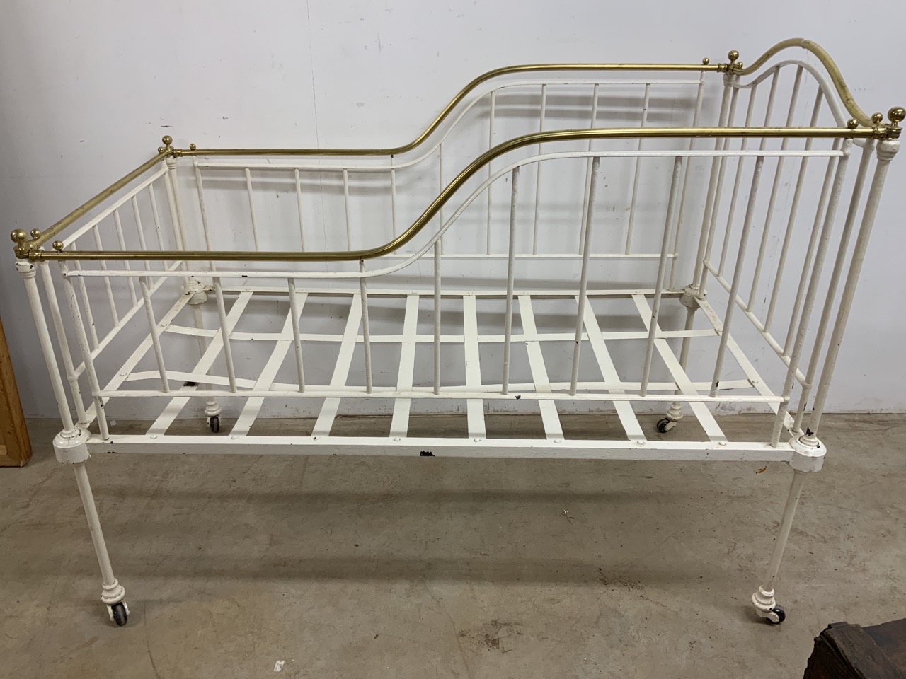 A Victorian brass and iron cot bed. W:140cm x D:75cm x H:111cm