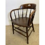 An early 20th century bentwood arm chair with turned supports and stretchers. H:45cm