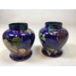 A pair of Titian Ware vases blue base decorated with fruits H:17cm