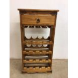 A pine wine storage rack with drawer W:52cm x D:27cm x H:102cm